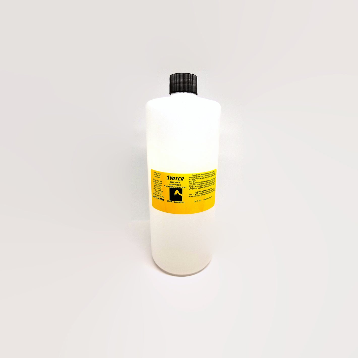 one bottle of syntek 32 oz dental handpiece lubricant with yellow label on white background